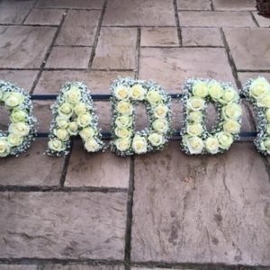 letter tribute rose and gypsophilia for funerals