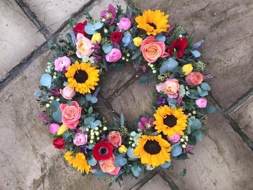 seasonal wreath for funerals by the dancing daffodil