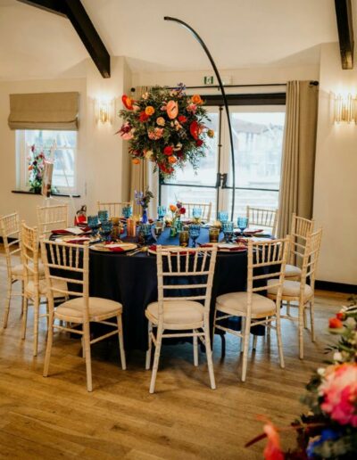 Image of wedding tables decorated by The Dancing Daffodil and using hanging cloud centrepieces created by Ryan the groom