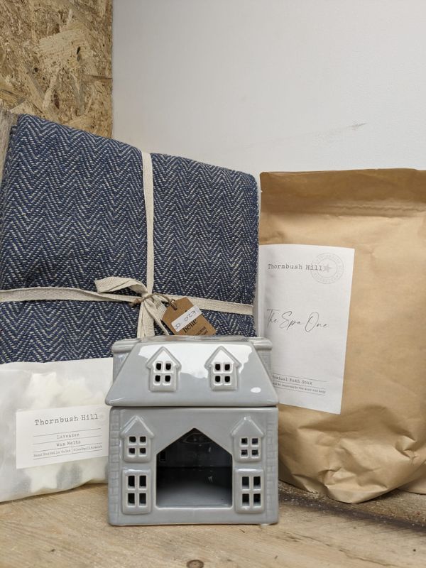 'The Spa One' bath soak by Thornbush Hill. cute little house wax burner. A  set of Thornbush Hill melts for the perfect gift combo. Sass & Belle throw. The classic navy and cream colourway makes it so versatile