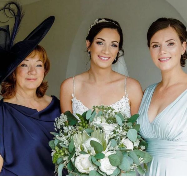 image of bride and bridesmaid with mother of the bride, flowers by The Dancing Daffodil