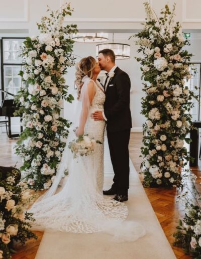 The Dancing Daffodil - Wedding Arch with Bethan & Nathan kissing