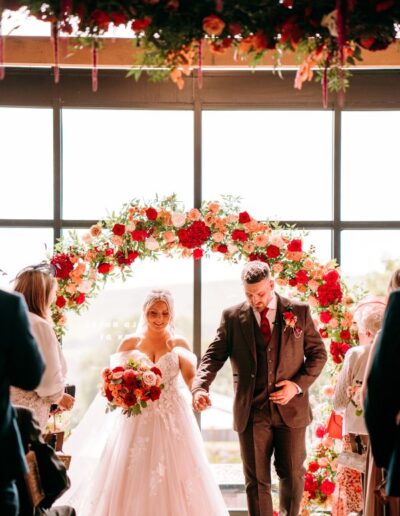 The Dancing Daffodil - Jordan & Joseph - Bride & Groom with flower arch