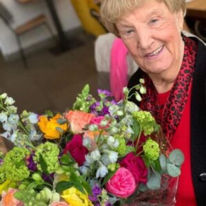 The Dancing Daffodil - Bouquet Workshop - Image of lady holding hand-tied bouquet